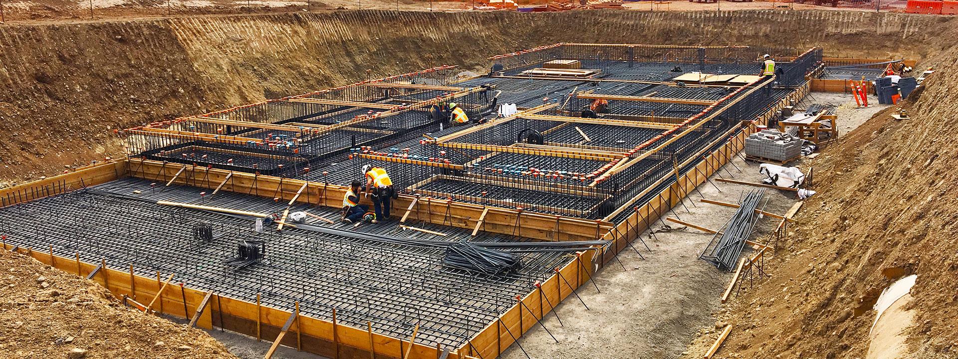 Large dig site with base being built for construction