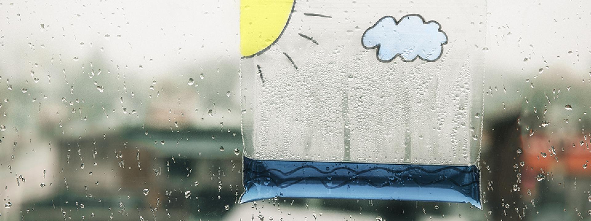 A child's plastic baggie holding rain water
