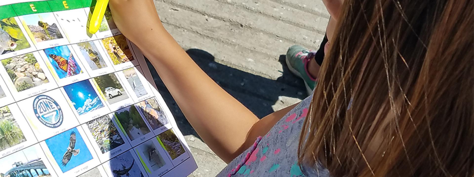 Child participating in an outdoor watershed activity