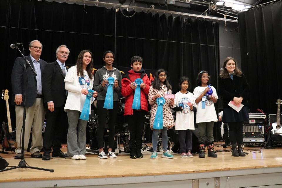 Students receive their One Water Awards from Zone 7 Director Dennis Gambs, Livermore Mayor John Marchand, and Cal Water Conservation Coordinator Margaret Golden. 