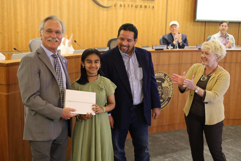 Photo #1: (Left to Right) Livermore Mayor John Marchand, grand prize winner Annapoorani Amarnath, Cal Water Livermore District Manager John Freeman, and Zone 7 Water Agency Board President Sarah Palmer. 