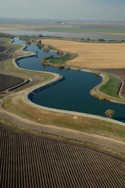 An overhead view of a winding aqueduct flowing off to the distance.