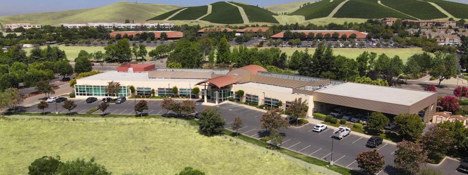 Aerial view of Zone 7 building headquarters, surrounded by green grass and hills