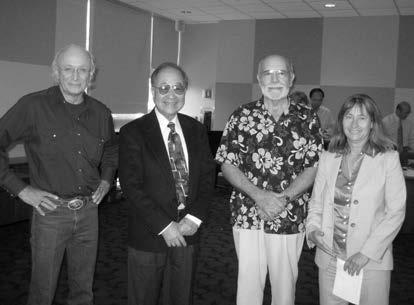 Four of Zone 7 Water Agency's former Board of Directors, standing shoulder to shoulder and smiling