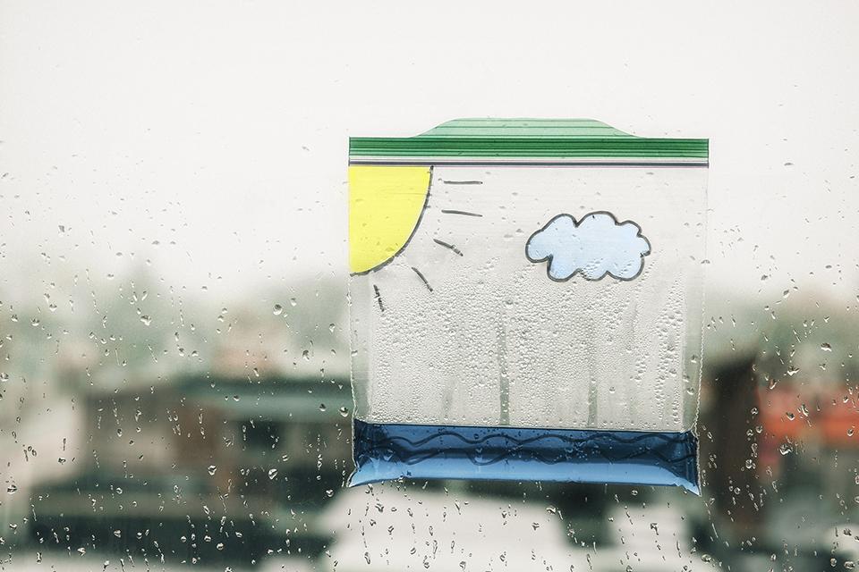 A child's plastic baggie holding rain water