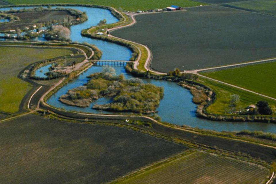 Aerial view of the Delta river, surrounded by green landscape