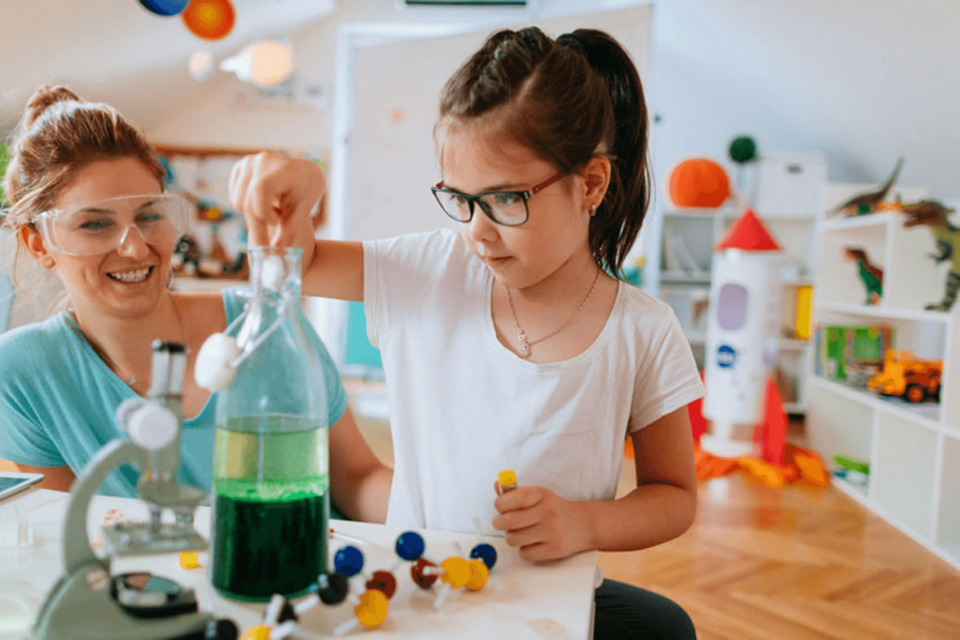 Child learning about water during an at-home lesson with their parent