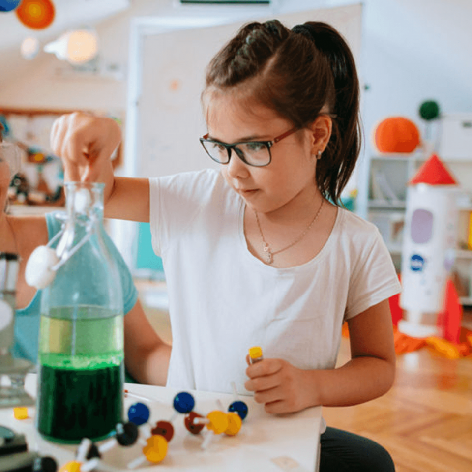 Child learning about water during an at-home lesson with their parent