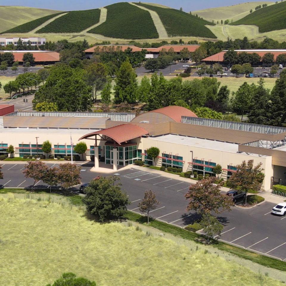 Aerial view of Zone 7 building headquarters, surrounded by green grass and hills