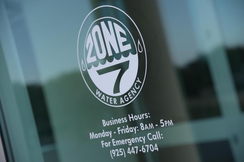 The window welcoming guests to Zone 7 headquarters, Business Hours: Monday through Friday, 8am - 5pm, For emergency call 925-447-6704
